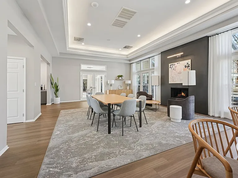 Resident lounge with fireplace and seating
