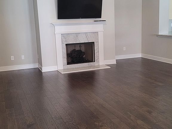 Vaulted great room with marble gas fireplace