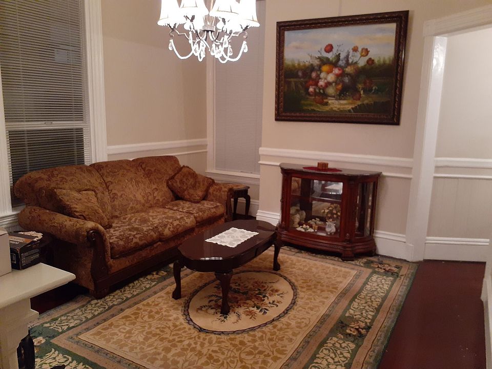LIVING ROOM SHOWS BEAUTIFUL PAINTING. ANOTHER EVEN LARGER GORGEOUS PAINTING IS OPPOSITE WALL OF AND VIEWED FROM THE COUCH