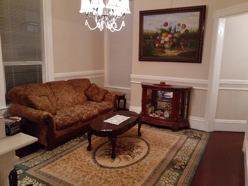 LIVING ROOM SHOWS BEAUTIFUL PAINTING. ANOTHER EVEN LARGER GORGEOUS PAINTING IS OPPOSITE WALL OF AND VIEWED FROM THE COUCH
