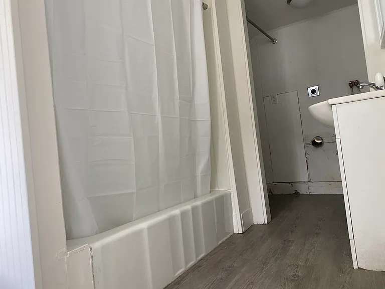 Bathroom with washer/dryer in closet