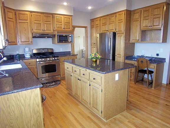 Kitchen w/new SS appl, granite counters, lighting & refinished hardwood floors