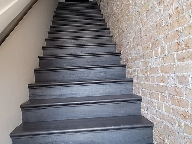 Staircase to unit 1 & 2. There are two units that share this private entrance.