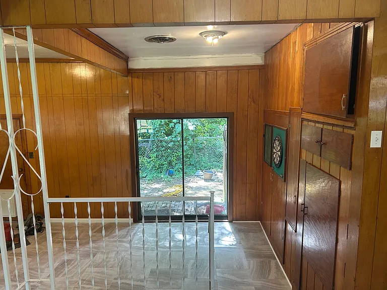 Closets and murphy bed along right wall