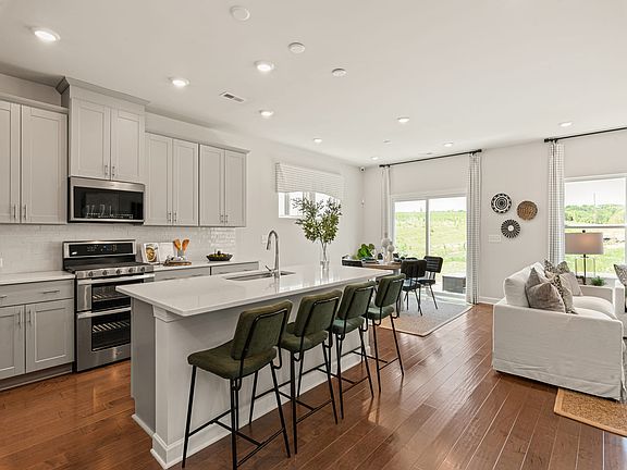 The large kitchen island is the perfect place to gather and catch up with friends.