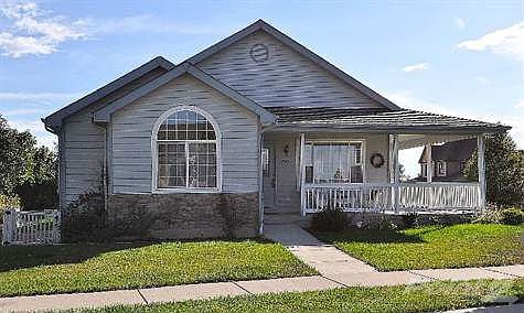 Nestled on a corner lot, gorgeous curb appeal!