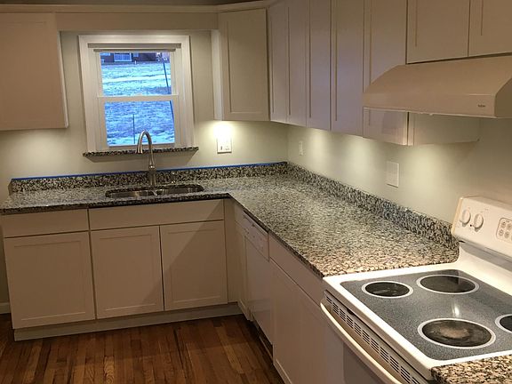 Kitchen - under cabinet lights, garbage disposal, vented exhaust fan, granite counter top, new cabinets