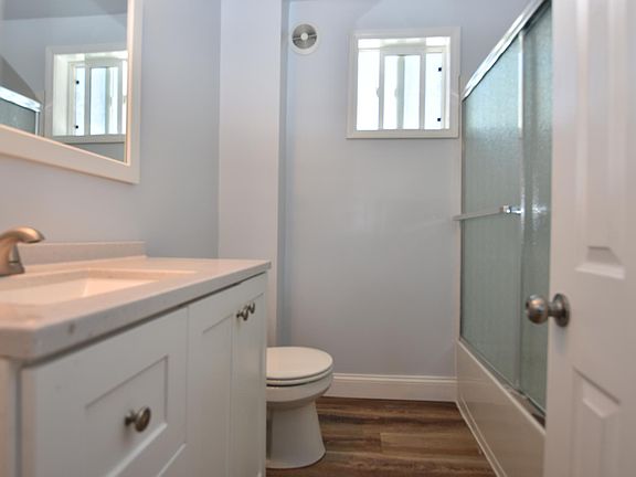Bathroom has full size tub and all new vanity, toilet, fan, fixtures.