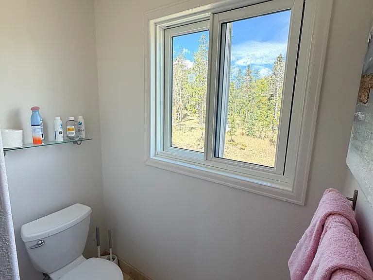 Master bathroom toilet area (fan) with new window