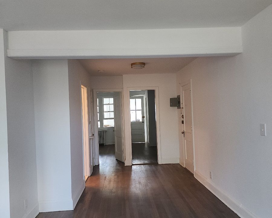 view from living room to bedroom and kitchen