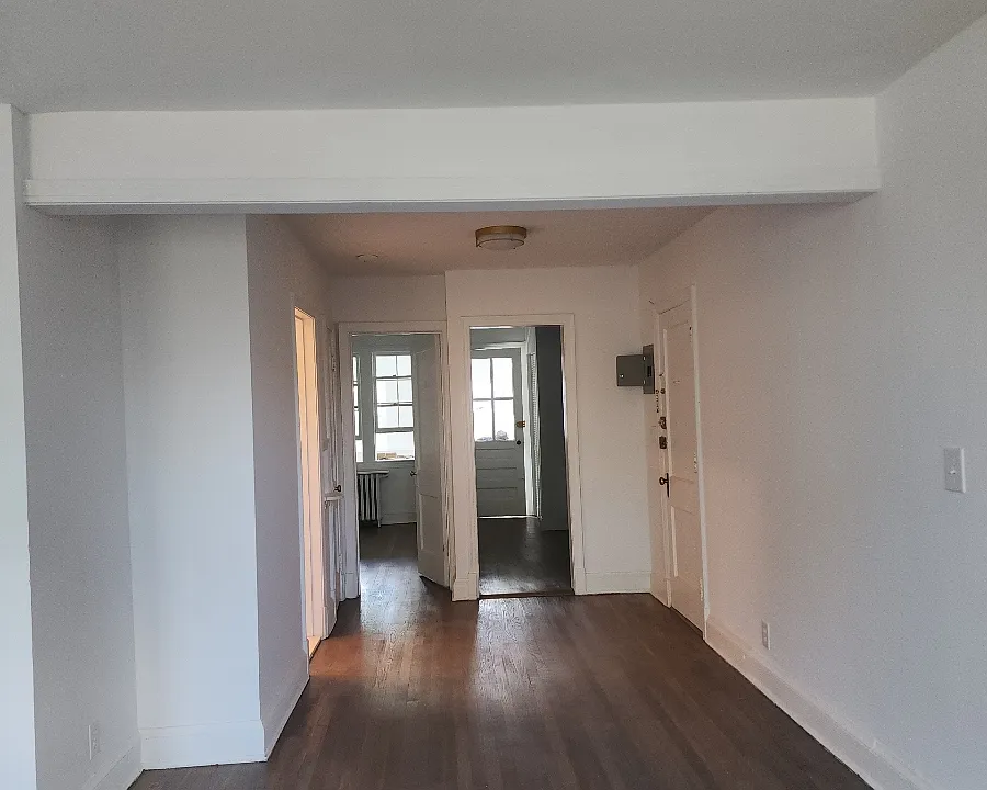 view from living room to bedroom and kitchen