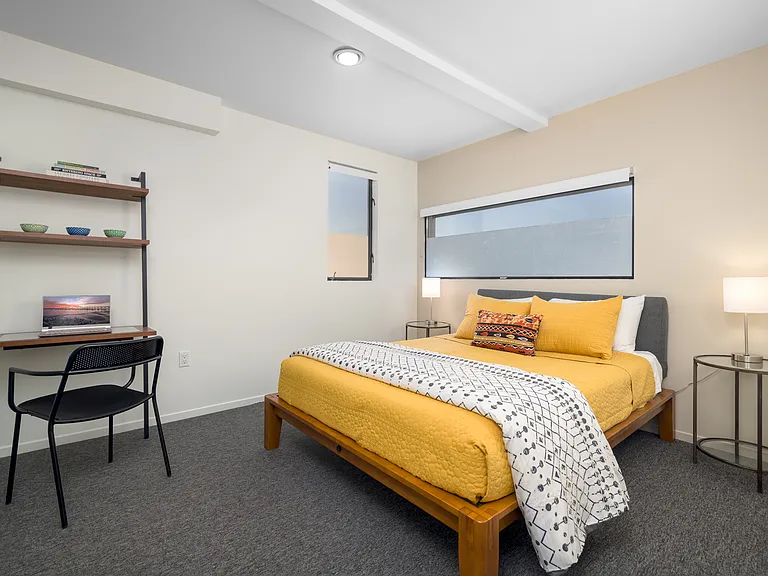 Bedroom #2 with queen bed, workspace and large closet
