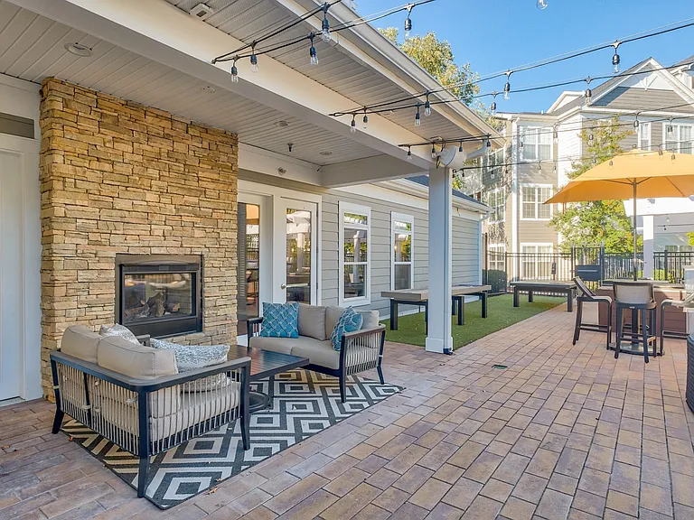 Elevated outdoor living spaces complete with a fireplace - perfect for hosting guests.