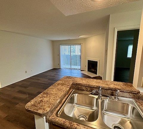 View of living room from galley style kitchen