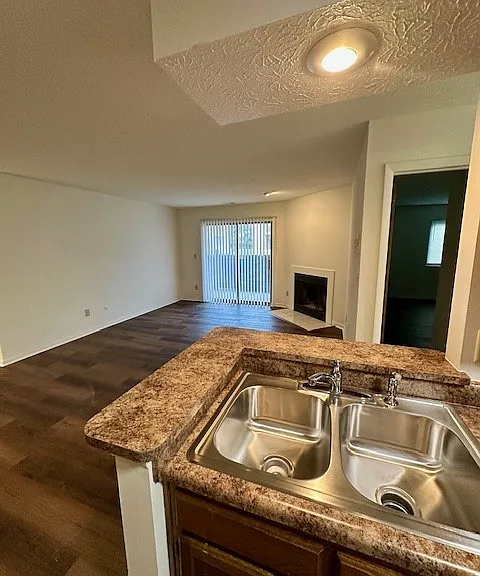 View of living room from galley style kitchen
