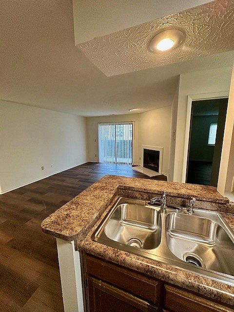 View of living room from galley style kitchen