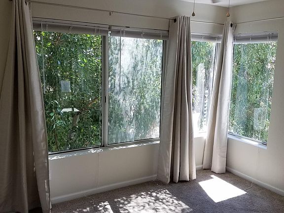 Bedroom 2 has an 8 foot closet, views and patio access.