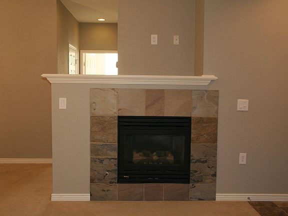 Beautiful fireplace with mantle.