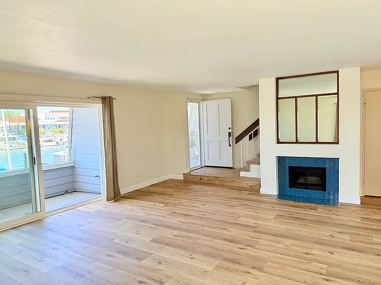 Inside of front door entry. Balcony to left, fireplace to right.