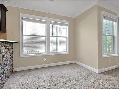 Dining room flows into livingroom with ample natural lighting