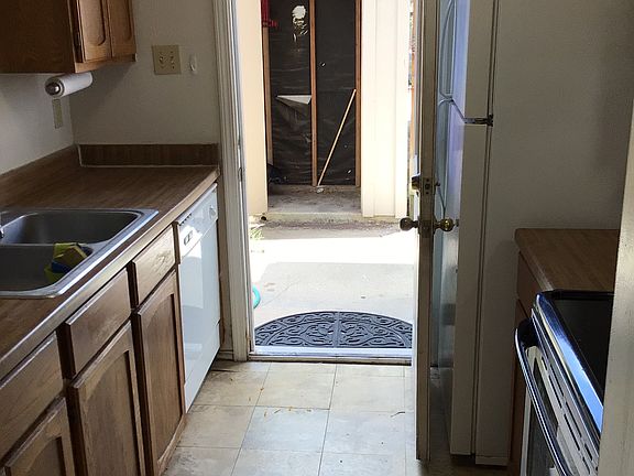 Kitchen to outside atio and storage area