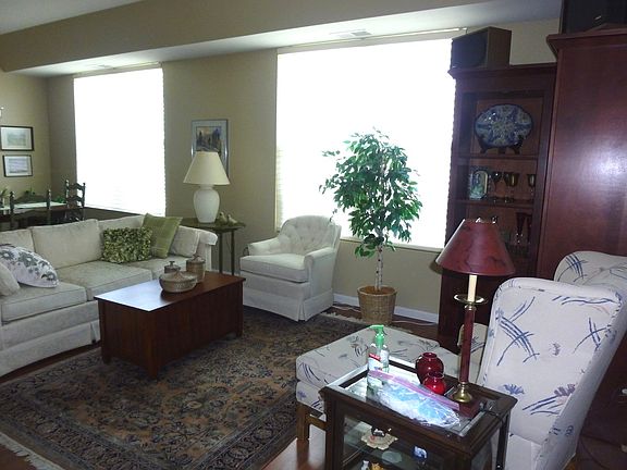 Beautiful and spacious with wood laminate floors and custom window treatments