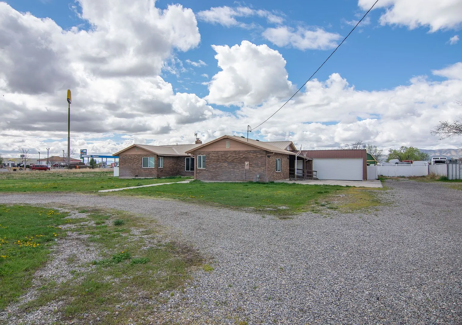 Spacious 3 Bed 2 Bath Brick Home with RV Parking, Shop Space & Large Yard in Tremonton! — Photo 1