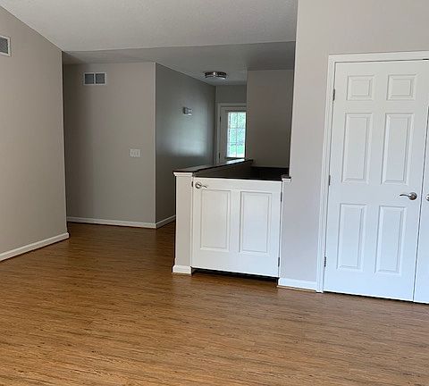 Living room closet, stairs to basement, hallway to bedrooms