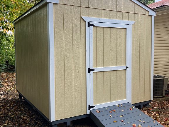 10ft x 12ft storage shed behind house