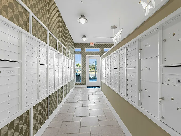 Step into a stylish mailroom thoughtfully designed for convenience and elegance.