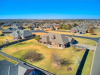 This oversized lot (0.75 ac) has plenty of room to play in the grassy yard or on the covered patio.
