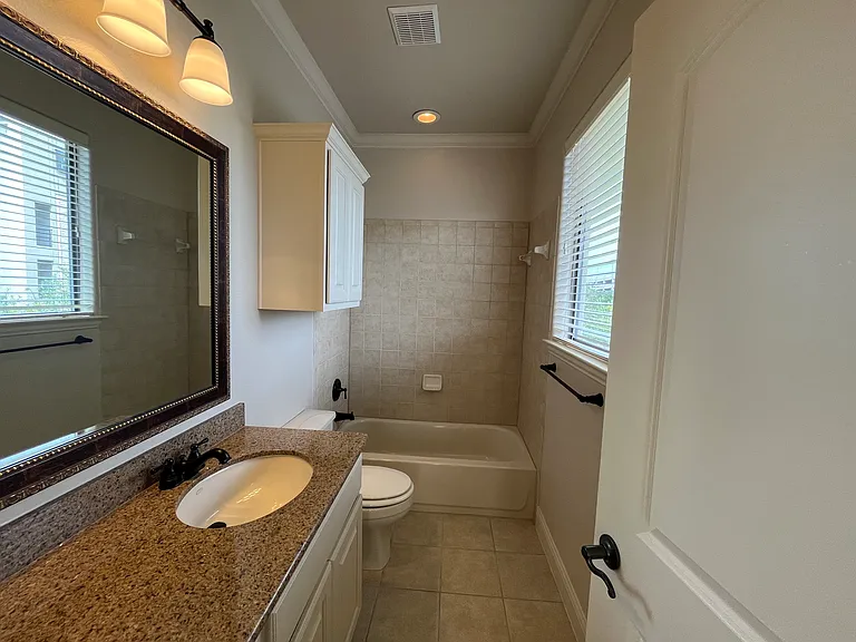 Third bedroom attached bath with designer cabinets