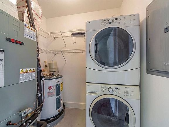 Laundry room in unit 
