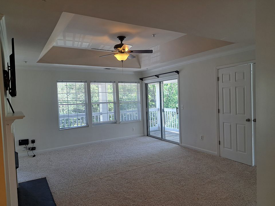 Living from another angle, showing the balcony through the sliding door. Check out the high ceiling giving it a majestic sense. You have to see it to believe how great it looks.