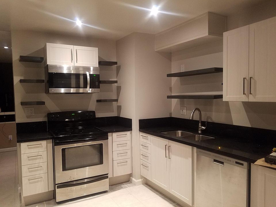 Remodeled kitchen. Tile floor. New stove, dishwasher and microwave.