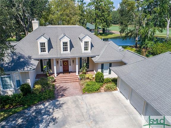 Inviting front porch, 3 Car Garage plus Lagoon views