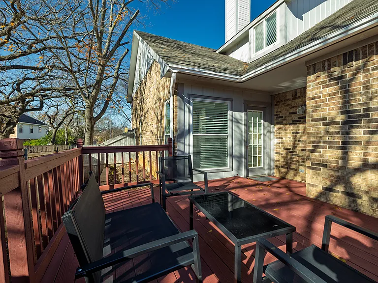 Spacious deck in the backyard with outdoor seating for family and friends!