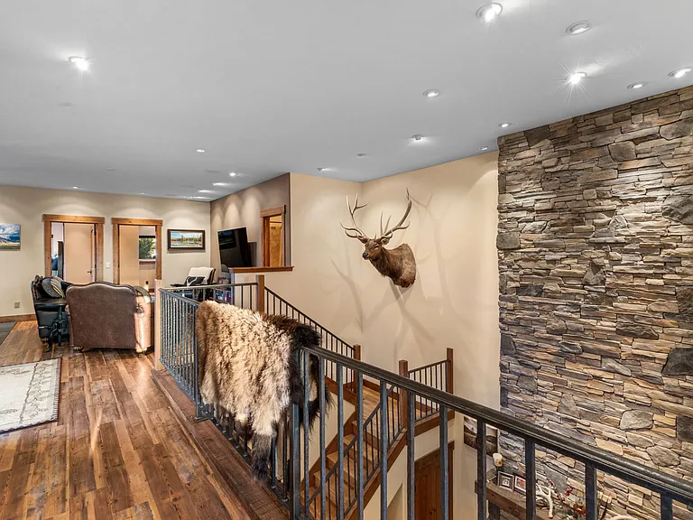 Dry stacked stone fireplace reaches two stories.