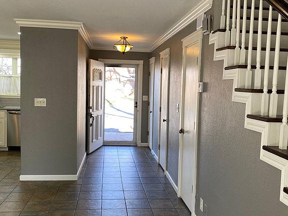 Entry with coat closet, power bath, under-stair storage