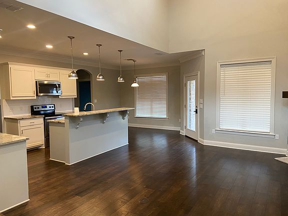 Open concept Living, kitchen, dining room & exit to rear yard