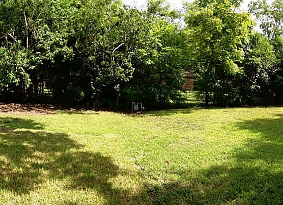 BACKYARD: Large over sized backyard with plenty of space for a pool.