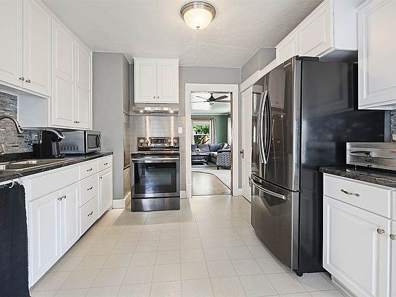 Large updated kitchen opens to sun drenched dining area.