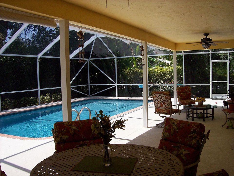 patio/pool w/ luscious landscaping
