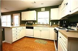 Open kitchen area with lots of storage and separate pantry.