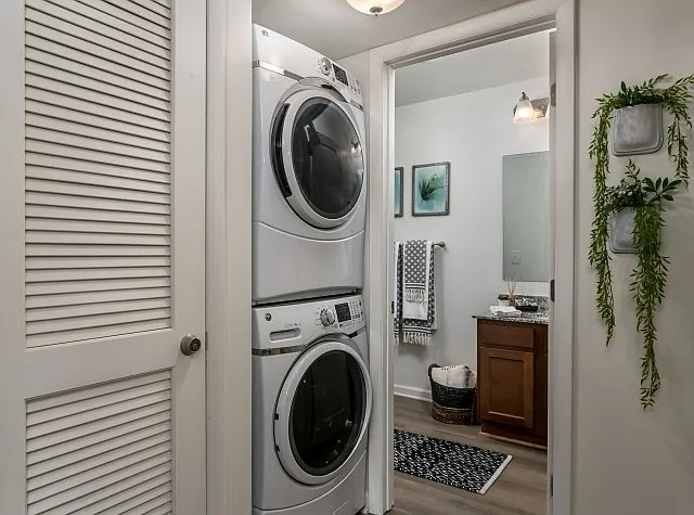 Enjoy the convenience of in-unit laundry next to a spacious bathroom at The Preserve at Tuscaloosa.