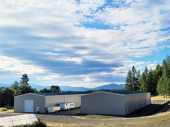 Beautiful big sky over the shop building.