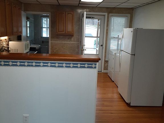 LOOKING INTO KITCHEN FROM LIVING ROOM