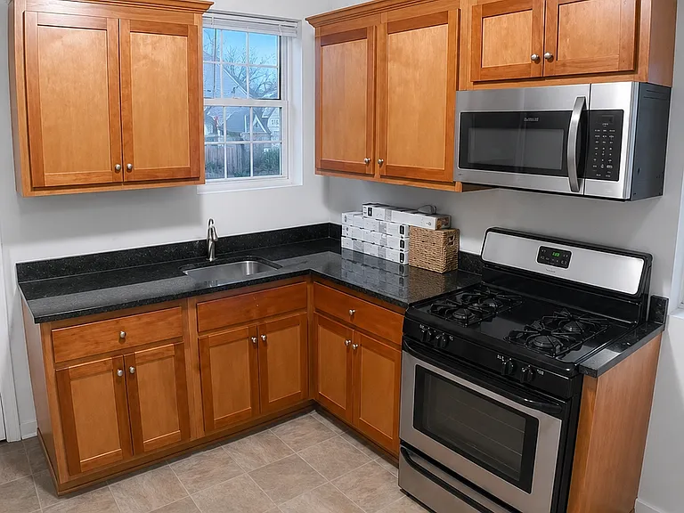 Kitchen with granite counter tops.