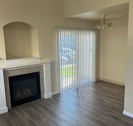 DINING ROOM WITH SLIDING GLASS DOOR TO PATIO AND STORAGE