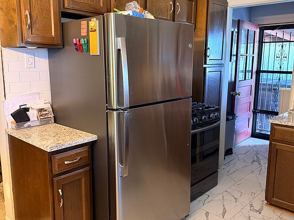 New refrigerator and stove. Side entrance is shared with upstairs and basement apartment.
